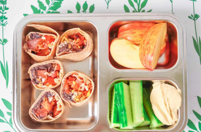 Healthy kid lunch ideas by slicing up veggies and grabbing an apple